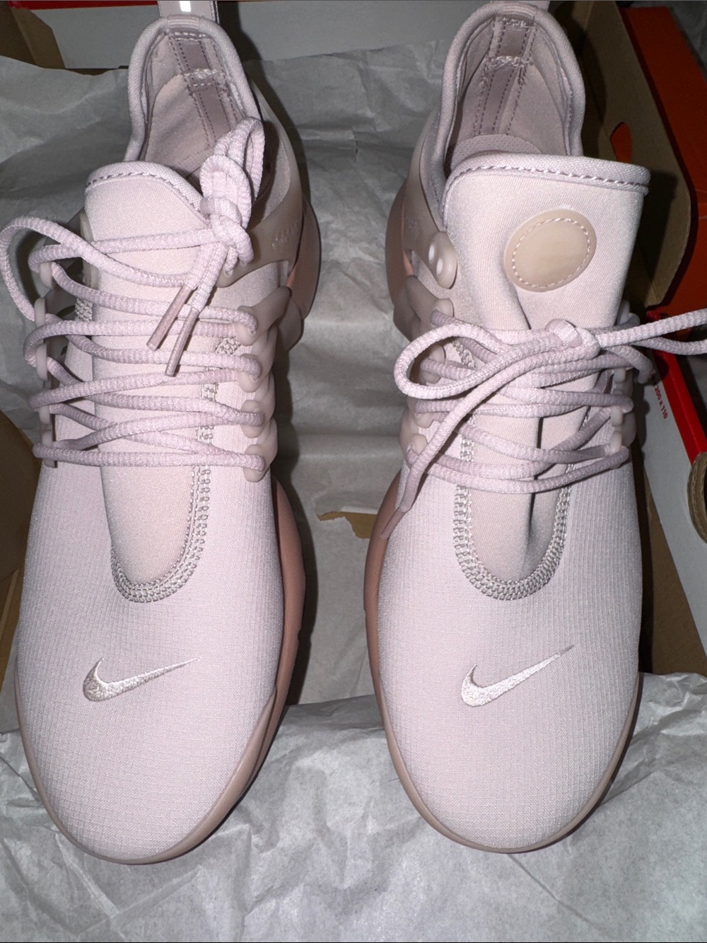 Nike Women’s Light Pink Slip-On Sneakers